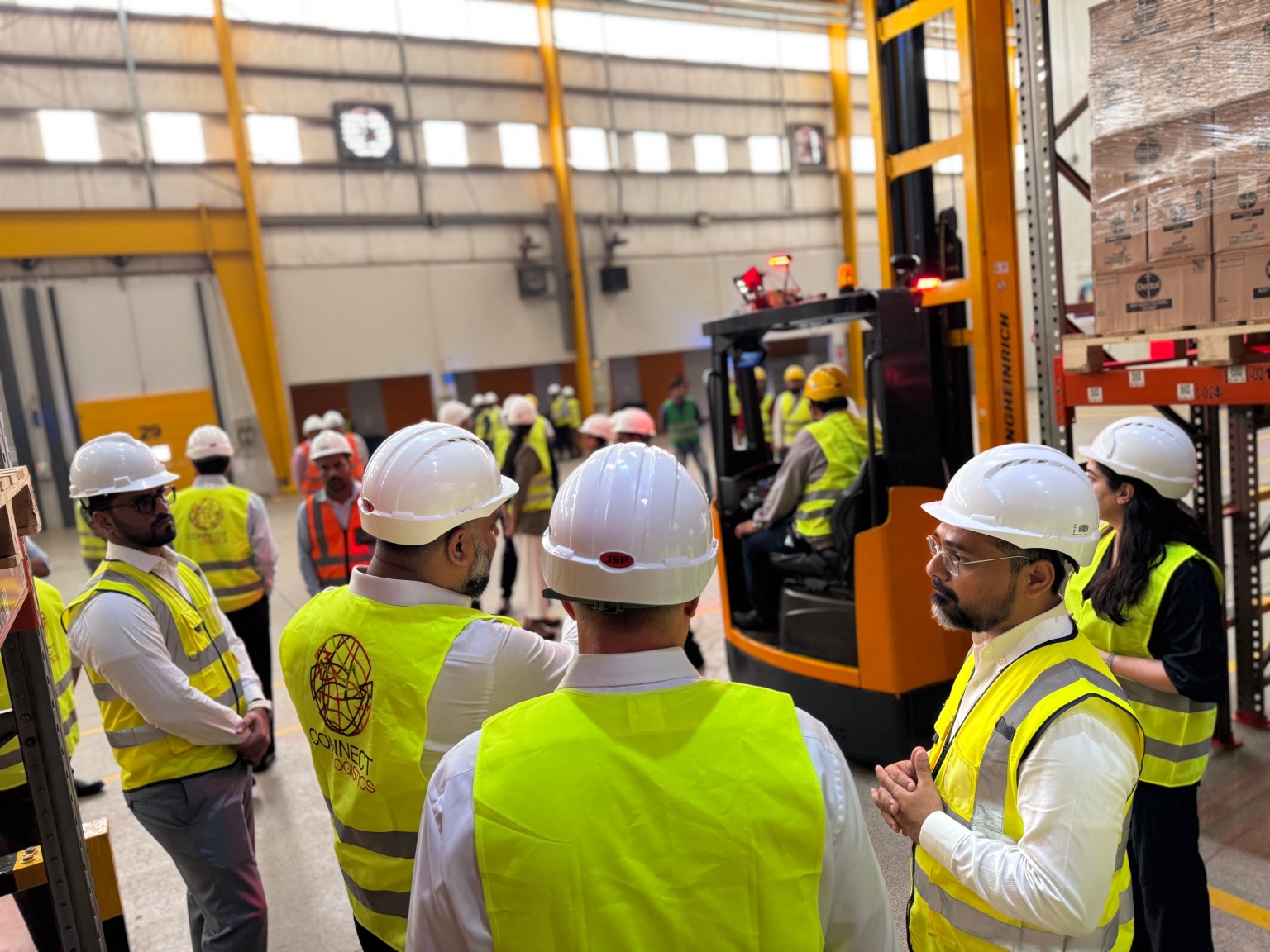 Reach truck demonstration during the Reckitt leadership tour of the Connect Logistics warehouse